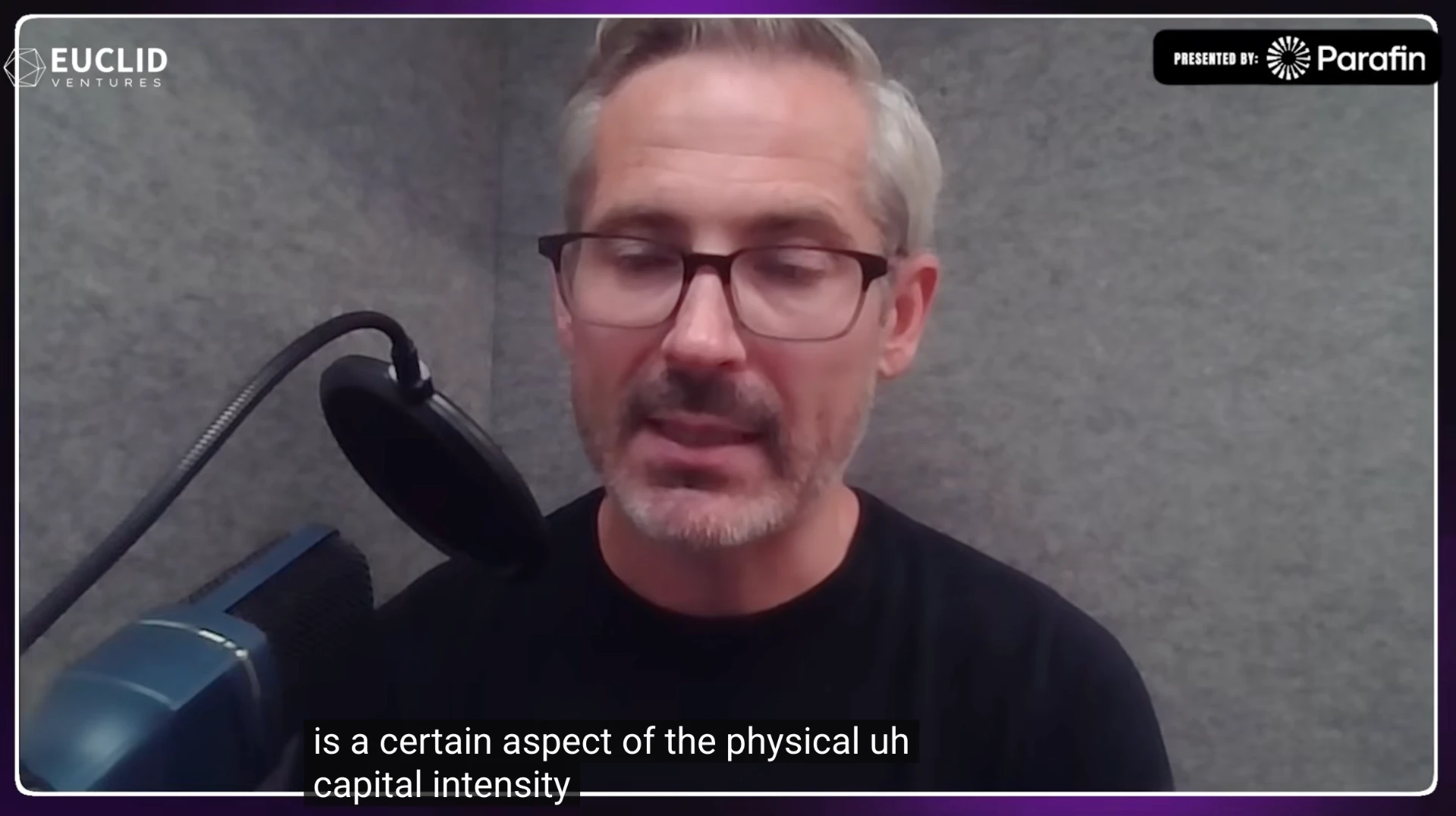 VERTICALS Podcast episode showing a presenting sponsor mark in the top-right of the frame